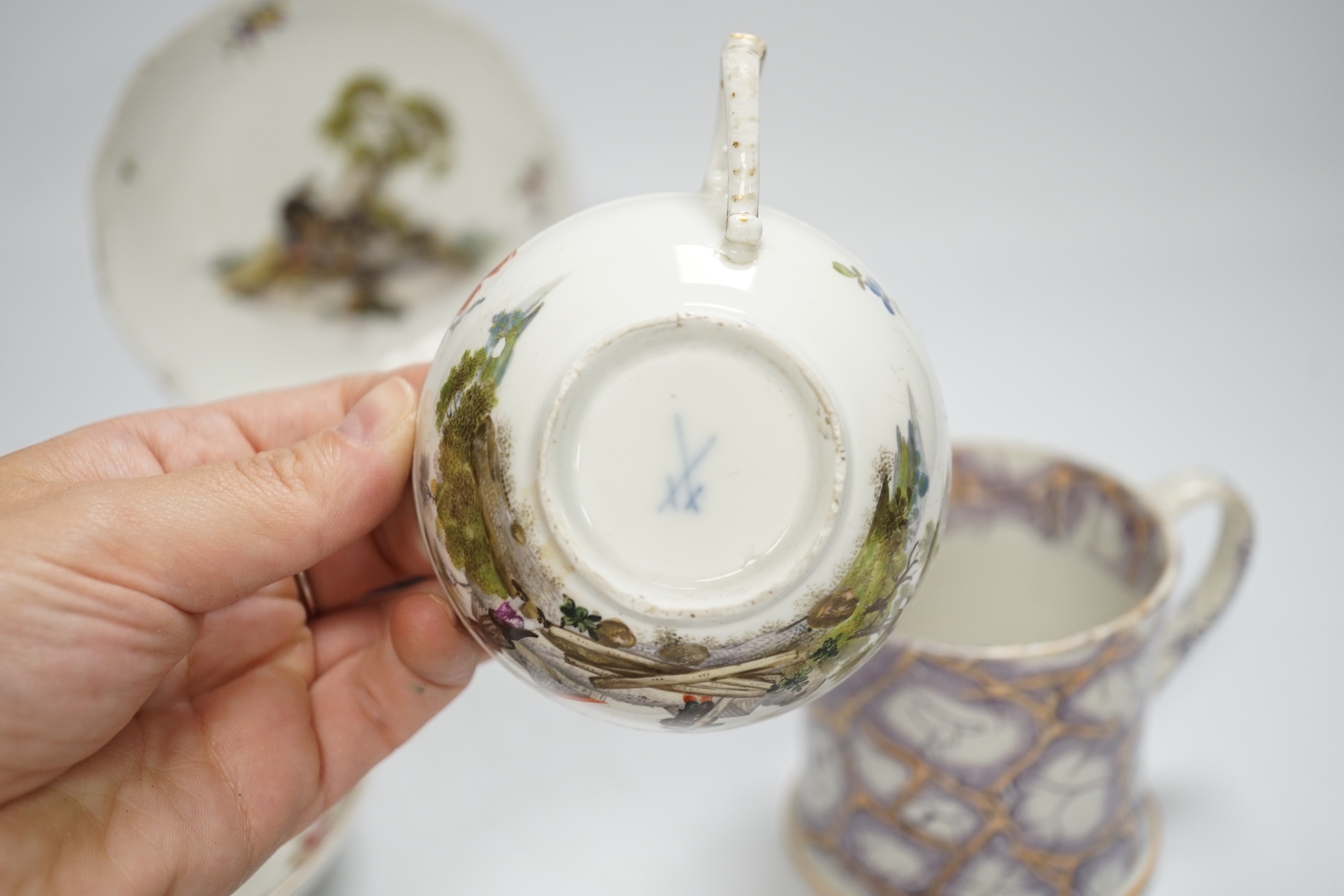 Two Derby porcelain coffee cans and one saucer, a tea bowl, a pearlware mug and a mid 18th century Meissen cup and saucer, tallest mug 8cm high